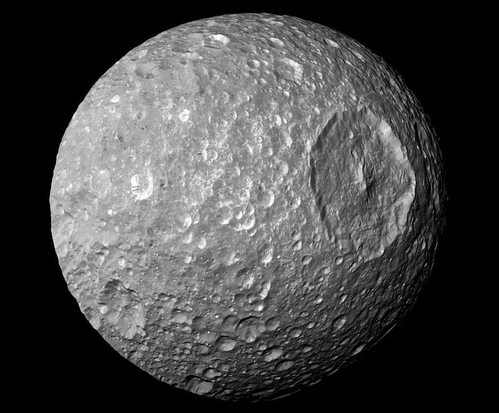 A view of Mimas from the Cassini spacecraft. The moon shows evidence of ancient impacts. Mimas is sometimes called the