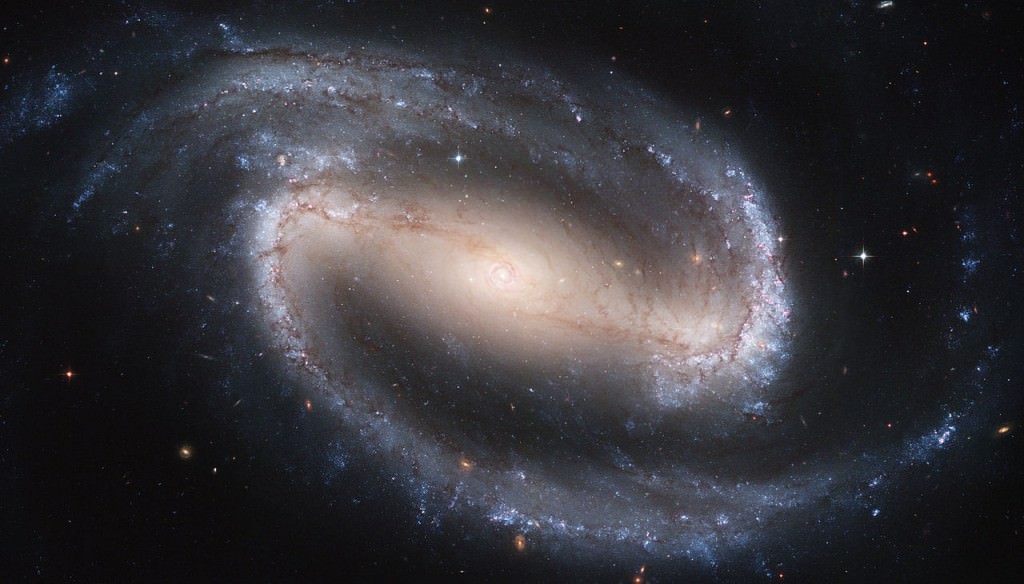 The Hubble is no stranger to barred spiral galaxies and has imaged many of them. This is NGC 1300, a spiral, barred galaxy viewed nearly face-on by the Hubble Space Telescope. Credit: NASA/ESA/Hubble