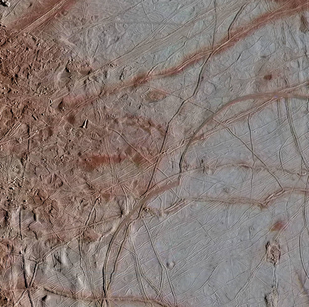 Newly re-processed Galileo images of Europa's surface show details that are visible in the variety of features on the moon's icy surface. This image of an area called Chaos Transition shows blocks that have moved and ridges possibly related to how the crust fractures from the force of Jupiter's gravity. Image Credit: NASA/JPL-Caltech/SETI Institute