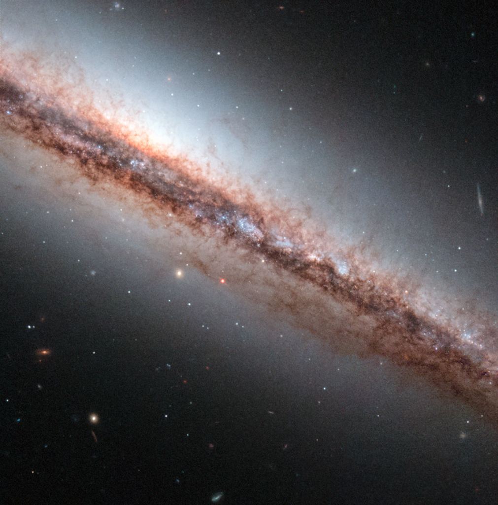 Image Hubble took of the NGS 4217 galaxy, which is the subject of the composite image just released.