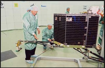 Clean Room photo of Philae with Principal Investigator Dr. Helmut Rosenbauer, Director at the Max-Planck-Institute for Aeronomy. Philae's mass is 100 kg including 21 kg of instrument payload It's dimensions are 1 × 1 × 0.8 meters (3.3 × 3.3 × 2.6 ft) Photo Credit: Max Planck Institute, Filser)