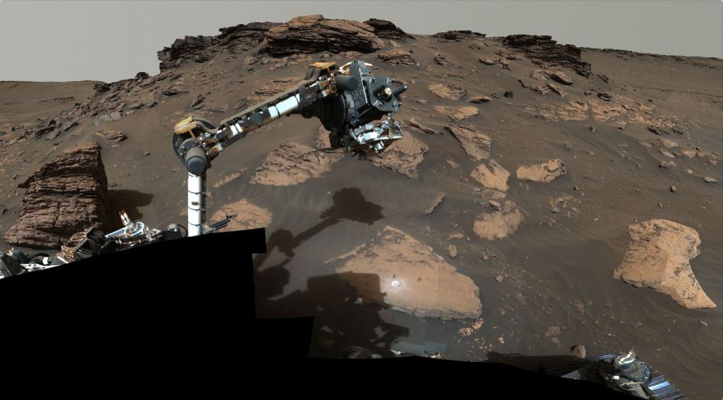 NASA's Perseverance rover puts its robotic arm to work around a rocky outcrop called