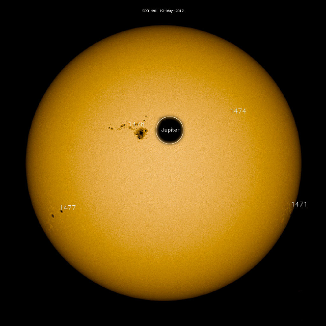 Jupiter is puny and insignificant compared to the Sun. And it's also hundreds of millions of kilometers away. How is a puny puff of hydrogen from Jupiter supposed to darken the Sun? Image: NASA/SDO