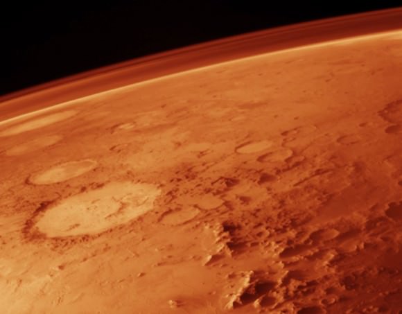 Mars' thin atmosphere, visible on the horizon, is too weak to retain heat. Credit: NASA