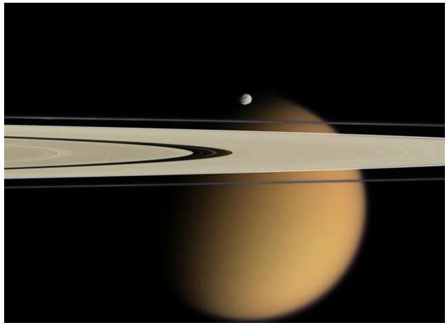 Satellite Rhea orbiting around Saturn pl... | Stock Video | Pond5