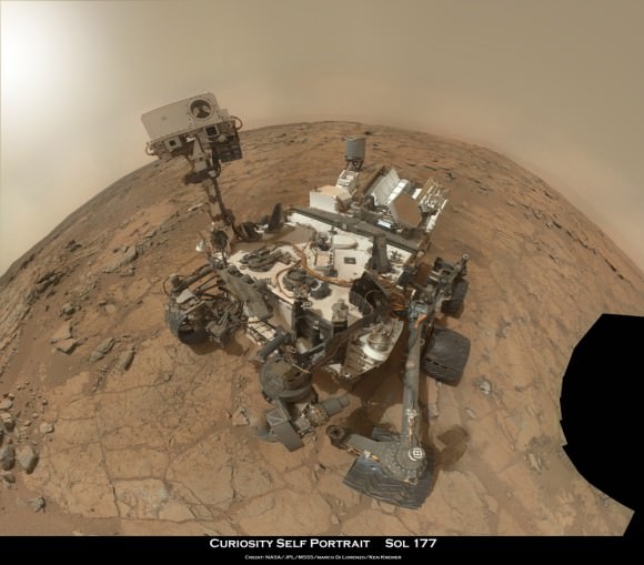 Rover self portrait MAHLI mosaic taken this week has Curiosity sitting on the flat rocks of the “John Klein” drilling target area within the Yellowknife Bay depression. Note gradual rise behind rover. Credit: NASA/JPL-Caltech/MSSS/Marco Di Lorenzo/www.KenKremer.com. 