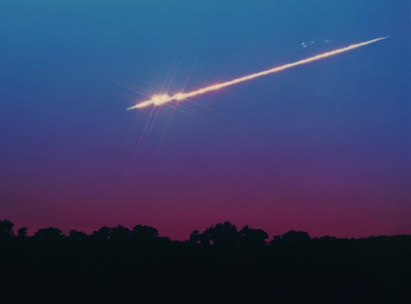A bright fireball meteor in twilight. The Lyrids, like all meteor showers, offer up the occasional fireball among a mix of fainter meteors. Credit: John Chumack