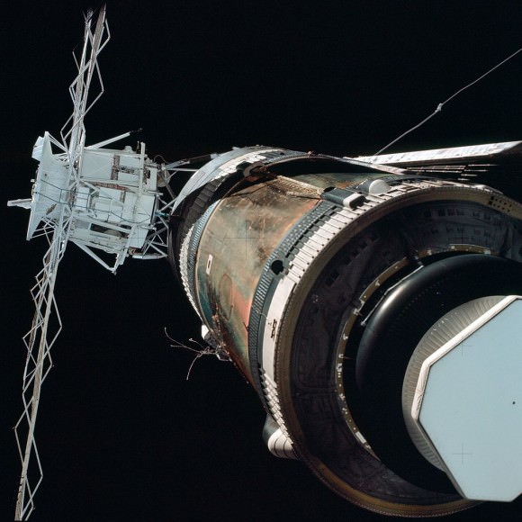 View of crippled Skylab complex during ‘fly around’ by the first crew shows missing  micrometeoroid shield and stuck solar panel which luckily was not ripped off during launch. Credit: NASA