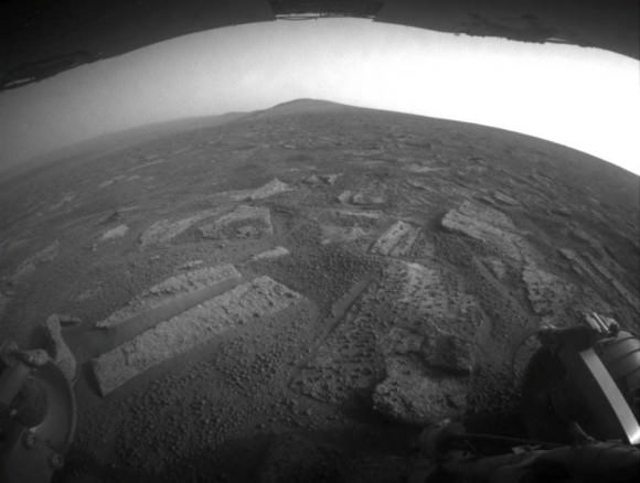 This view from July 2, 2013 (Sol 3355) shows the terrain that NASA's Mars Exploration Rover Opportunity is crossing  in a flat area called "Botany Bay" on the way toward "Solander Point," which is visible on the horizon. Credit: NASA/JPL-Caltech