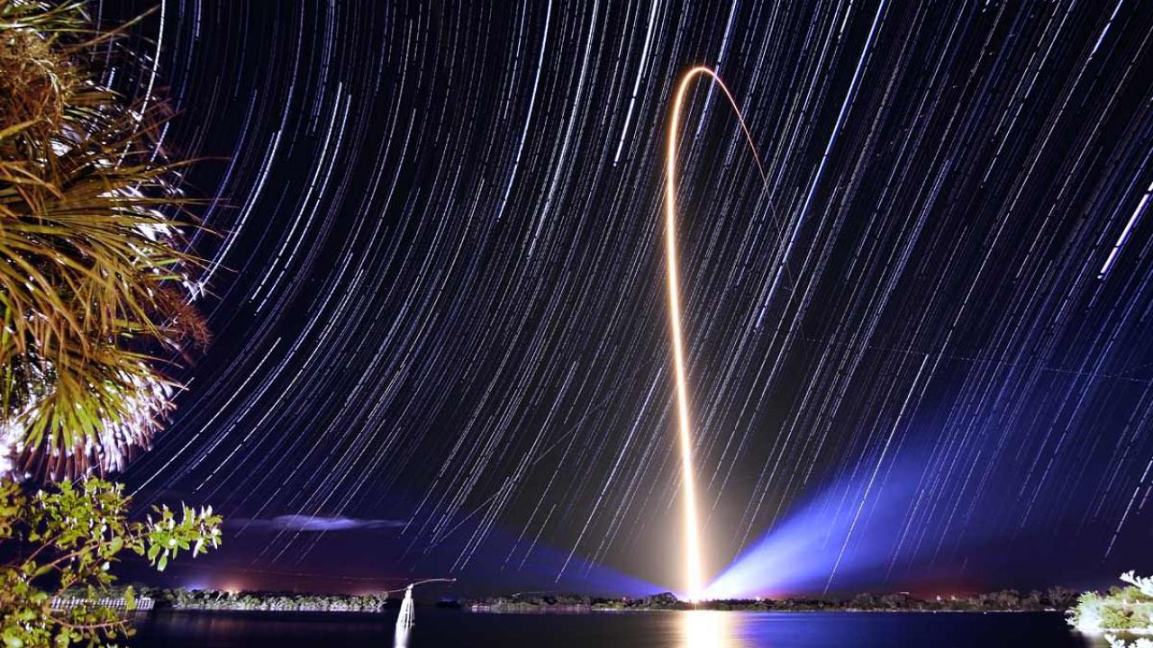 Rocket trails move sideways through the sky