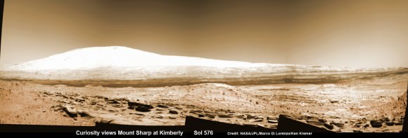 Martian landscape with rows of curved rock outcrops at ‘Kimberly’ in the foreground and spectacular Mount Sharp on the horizon. NASA’s Curiosity Mars rover pulled into Kimberly waypoint dominated by layered rock outcrops as likely drilling site.  This colorized navcam camera photomosaic was assembled from imagery taken on Sol 576 (Mar. 20, 2014).  Credit: NASA/JPL-Caltech/Marco Di Lorenzo/Ken Kremer-kenkremer.com