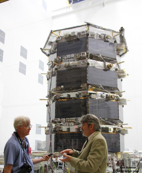 MMS Project Manager Craig Tooley (right) and Ken Kremer (Universe Today) discuss  science objectives of NASA’s upcoming Magnetospheric Multiscale mission by 20 foot tall mated quartet of stacked spacecraft at the cleanroom at NASA's Goddard Space Flight Center in Greenbelt, Md., on May 12, 2014.  Credit: Ken Kremer- kenkremer.com