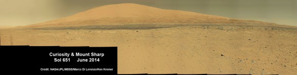 Curiosity rover panorama of Mount Sharp captured on June 6, 2014 (Sol 651) during traverse inside Gale Crater.  Note rover wheel tracks at left.  She will eventually ascend the mountain at the ‘Murray Buttes’ at right later this year. Assembled from Mastcam color camera raw images and stitched by Marco Di Lorenzo and Ken Kremer.   Credit:   NASA/JPL/MSSS/Marco Di Lorenzo/Ken Kremer-kenkremer.com 