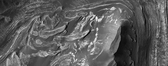 A section of the vast Valles Marineris ravine called Melas Chasma, a spot where sulfates (minerals formed in water) have been found before. The image shows layers of deposits that were formed before and after the formation of VAlles Marineris. Credit: NASA/JPL/University of Arizona