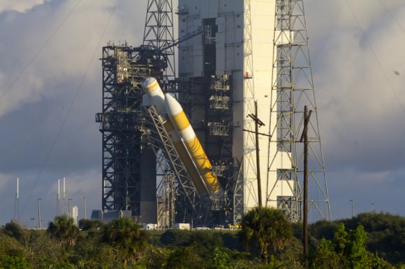 ULA Delta IV Heavy rocket launching NASA’s Orion’s EFT-1 in Dec. 2014 being hoisted vertical at SLC-37B on the morning of Oct. 1, 2014. Credit: Jeff Seibert/Wired4Space