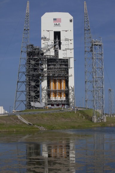 With access doors at Space Launch Complex 37 opened, the Orion and Delta IV Heavy stack is visible in its entirety inside the Mobile Service Tower where the vehicle is undergoing launch preparations.  Credit: NASA/Kim Shiflett