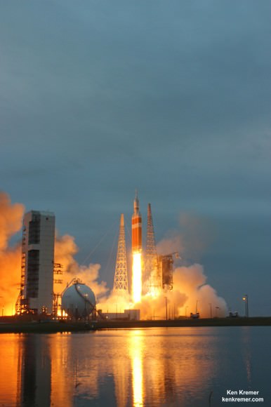 NASA’s first Orion spacecraft blasts off at 7:05 a.m. atop United Launch Alliance Delta 4 Heavy Booster at Space Launch Complex 37 (SLC-37) at Cape Canaveral Air Force Station in Florida on Dec. 5, 2014.   Launch pad remote camera view.   Credit: Ken Kremer - kenkremer.com 