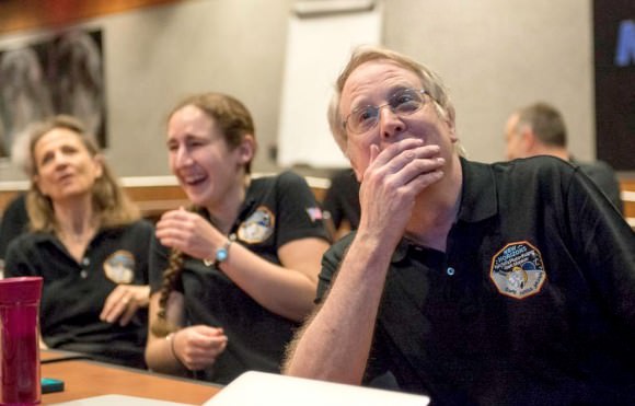 Members of NASA's New Horizons team react to seeing the latest image of Pluto. Credit: NASA