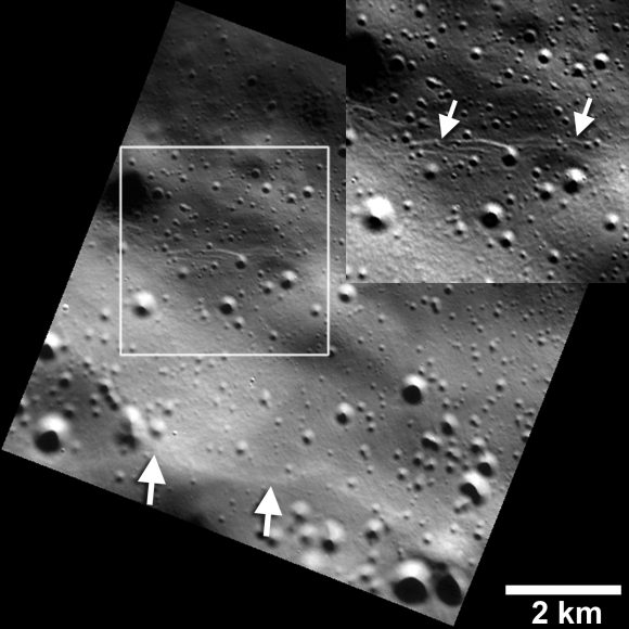 Small graben, or narrow linear troughs, have been found associated with small fault scarps (lower white arrows) on Mercury, and on Earth’s moon. The small troughs, only tens of meters wide (inset box and upper white arrows), likely resulted from the bending of the crust as it was uplifted, and must be very young to survive continuous meteoroid bombardment. Credits: NASA/JHUAPL/Carnegie Institution of Washington/Smithsonian Institution