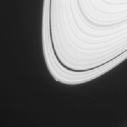 This Cassini image shows what might be a new moon forming in Saturn's rings. The new moon, if it is one, is only about 1 km in diameter. By NASA/JPL-Caltech/Space Science Institute - http://photojournal.jpl.nasa.gov/jpeg/PIA18078.jpg, Public Domain, https://commons.wikimedia.org/w/index.php?curid=32184174