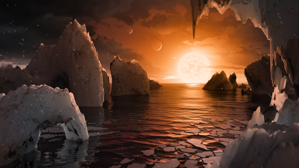 This artist's illustration shows the possible surface of TRAPPIST-1f, one of the newly discovered planets in the TRAPPIST-1 system. Credits: NASA/JPL-Caltech