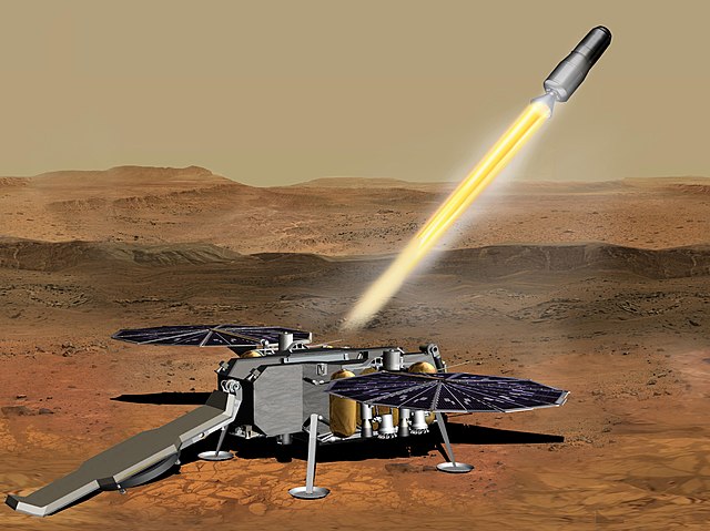 The proposed Mars Sample Return missions would send a spacecraft to Mars to gather samples collected by the Mars Perseverance (2020) Rover and then return them to Earth. Image Credit: By NASA/JPL-Caltech - https://photojournal.jpl.nasa.gov/jpeg/PIA23496.jpg, Public Domain, https://commons.wikimedia.org/w/index.php?curid=86914810