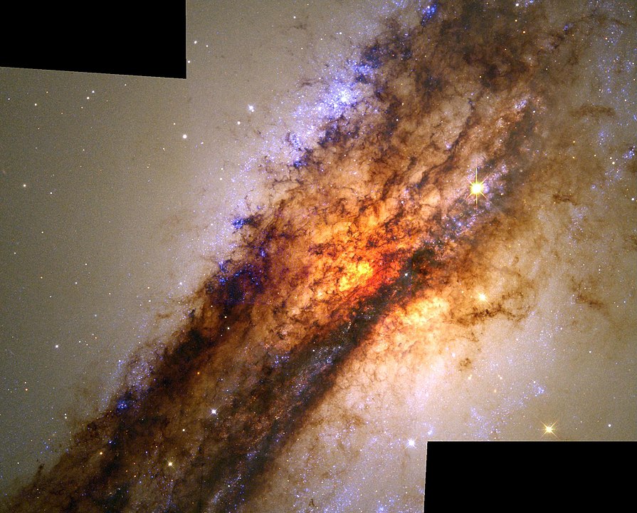 A Hubble Space Telescope image of the disk of dust obscuring Centaurus A's central region. Image Credit: NASA/ESA/Hubble