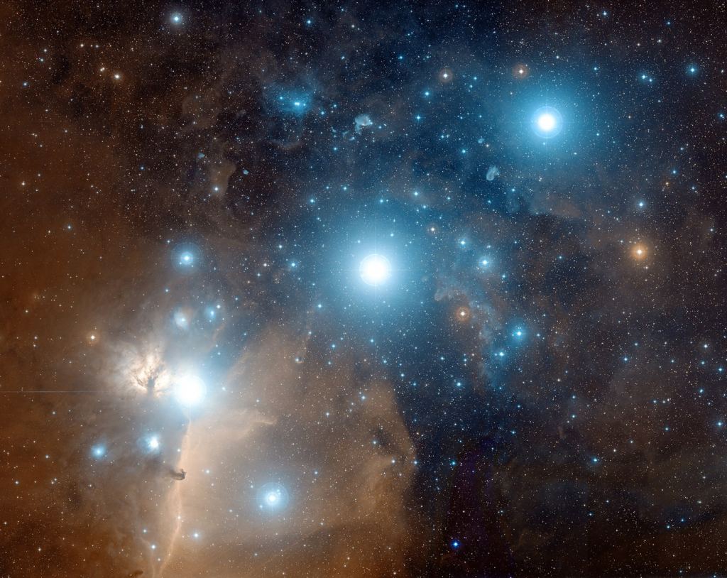 The Horsehead Nebula is visible in this image of Orion's Belt. It's in the lower left, extending horizontally, to the lower left of the belt star Alnitak. Image Credit: By Davide De Martin ( Credit: Digitized Sky Survey, ESA/ESO/NASA FITS Liberator -  (direct link), Public Domain, 