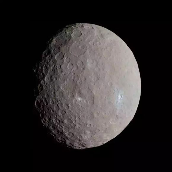 NASA's Dawn spacecraft captured this approximately true-color image of Ceres in 2015 as it approached the dwarf planet. Dawn showed that some polar craters on Ceres hold ancient ice, but new research suggests the ice is much younger. Image Credit: NASA / JPL-Caltech / UCLA / MPS / DLR / IDA / Justin Cowart