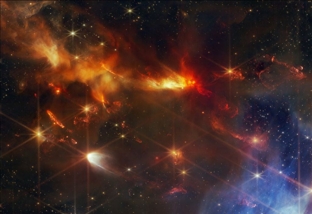 This image from the NASA/ESA/CSA James Webb Space Telescope shows a portion of the Serpens Nebula, where astronomers have discovered a grouping of aligned protostellar outflows. These jets are signified by bright, clumpy streaks that appear red, which are shock waves from the jet hitting surrounding gas and dust. Here, the red colour represents the presence of molecular hydrogen and carbon monoxide. Image Credit: NASA, ESA, CSA, STScI, K. Pontoppidan (NASA’s Jet Propulsion Laboratory), J. Green (Space Telescope Science Institute)