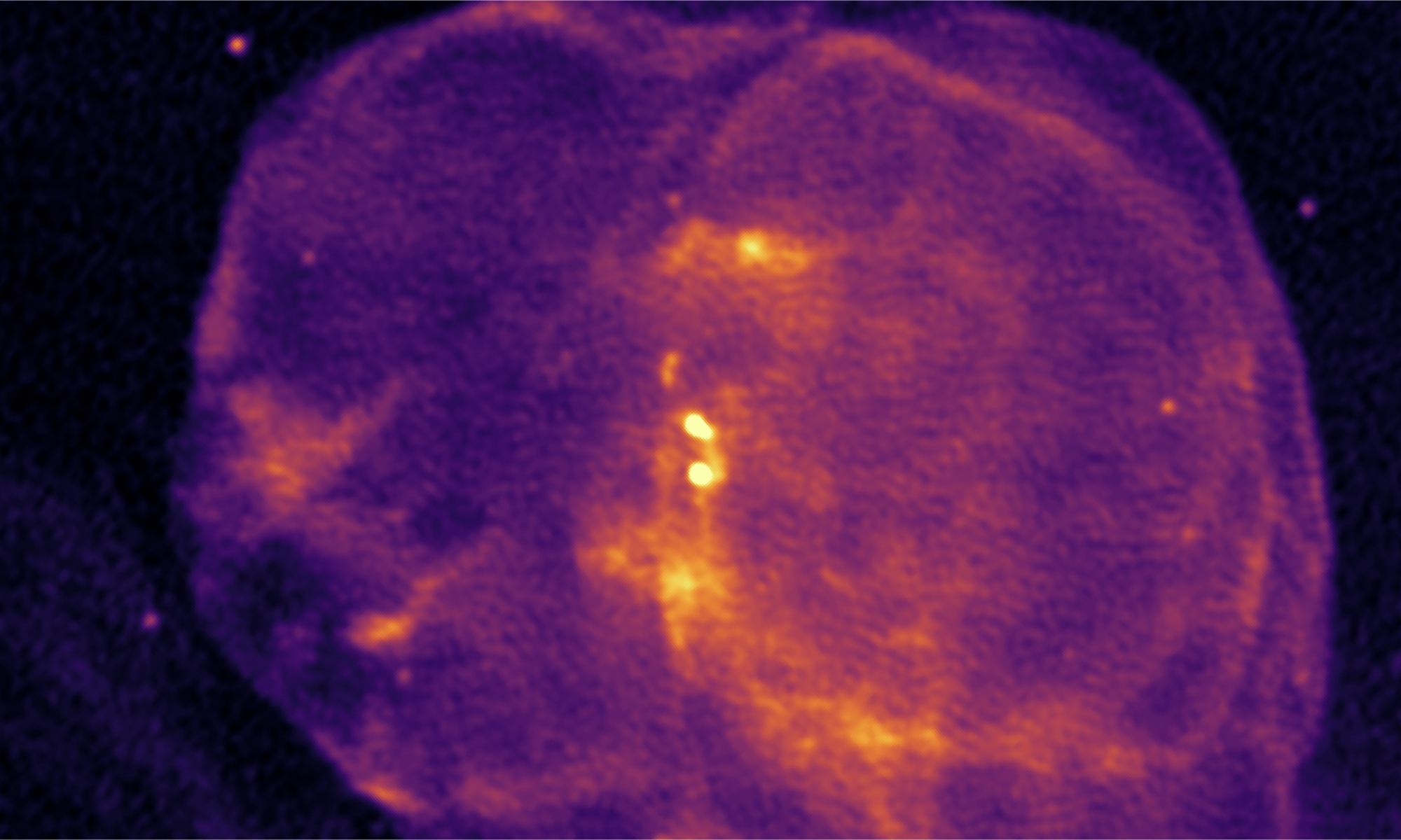 Radio image from the MeerKAT telescope showing Circinus X-1 in the center, within the spherical remnant of the supernova it was born in. The shock waves caaued by the jets are seen above and below Cir X-1, and the S-shape structure in the jets is somewhat obscured by a bright source in the background. Courtesy Fraser Cowie, Attribution CC BY 4.0.