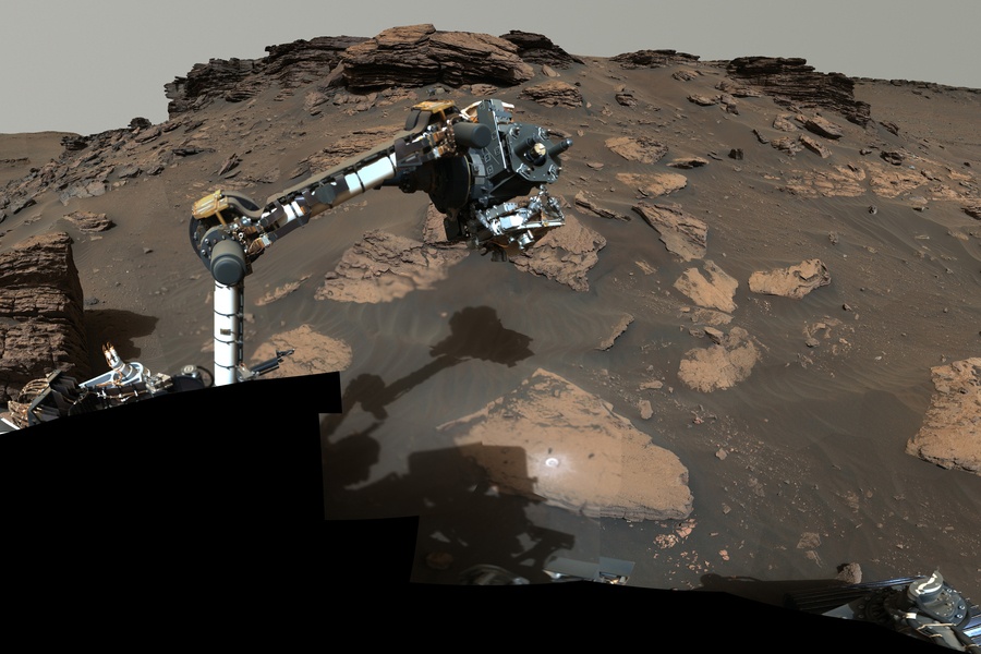 NASA's Perseverance rover puts its robotic arm to work around a rocky outcrop called 