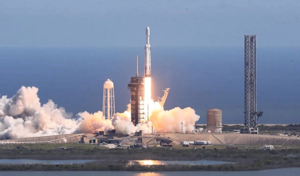 SpaceX's Falcon Heavy rocket sends NASA's Europa Clipper into space from its Florida launch pad. If all goes well, the Falcon Heavy will launch the Dragonfly mission to Titan in July, 2028. (NASA Photo / Kim Shiflett)