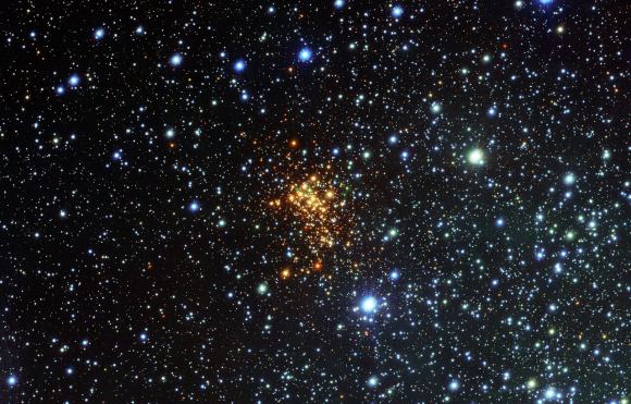 A view of Westerlund 1 from the VLT Survey Telescope (VST) at ESO's Paranal Observatory. One of its stars (called W26) is a red supergiant seems to be surrounded by clouds of hydrogen gas. It's the first ionized nebula to be seen around a red supergiant star. Courtesy European Southern Observatory.