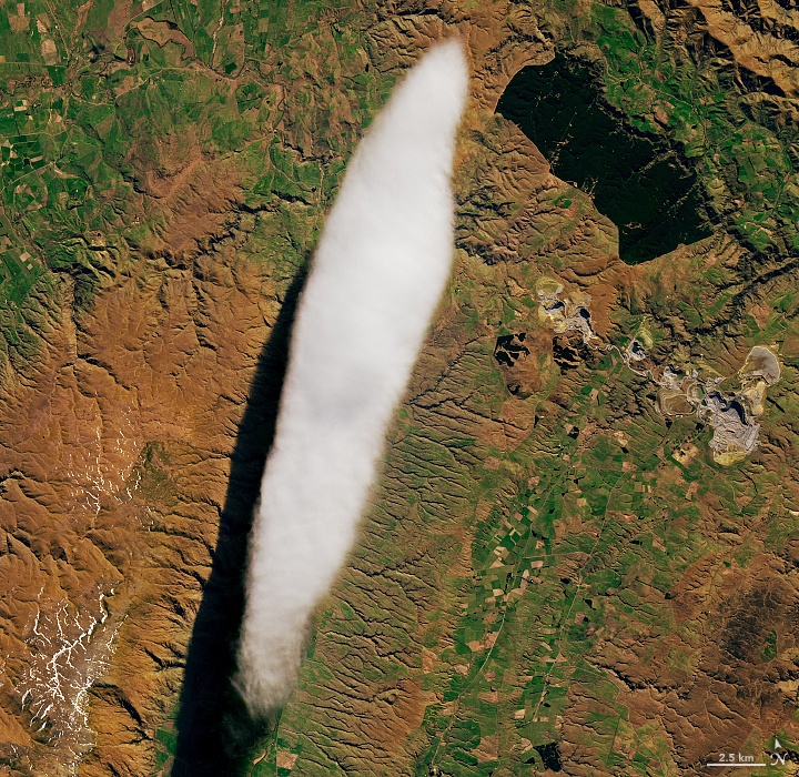 This zoomed-in image shows the cloud and the surface in more detail. The image shows the Macraes Mine, New Zealand's largest gold mine. Image Credit: NASA/Lauren Dauphin; USGS