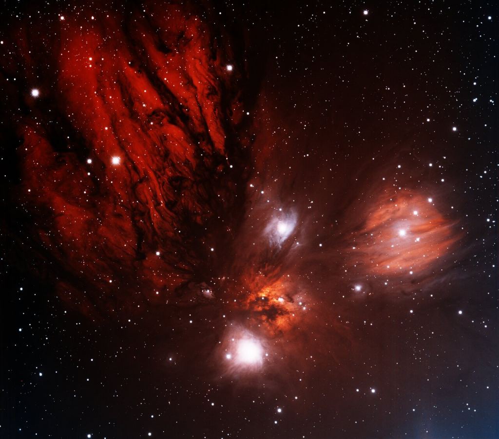 The Monoceros R2 Molecular Cloud is one of SPHEREx's targets. This image shows only a portion of the cloud, which is a large cloud with lots of active star formation. Star formation is particularly active in the location of the bright red nebula just below the center of the image. This image was obtained with the wide-field view of the Mosaic II camera on the Blanco 4-meter telescope at Cerro Tololo Interamerican Observatory on January 11th, 2012. Image Credit: T.A. Rector (University of Alaska Anchorage) and N.S. van der Bliek (NOIRLab/NSF/AURA)